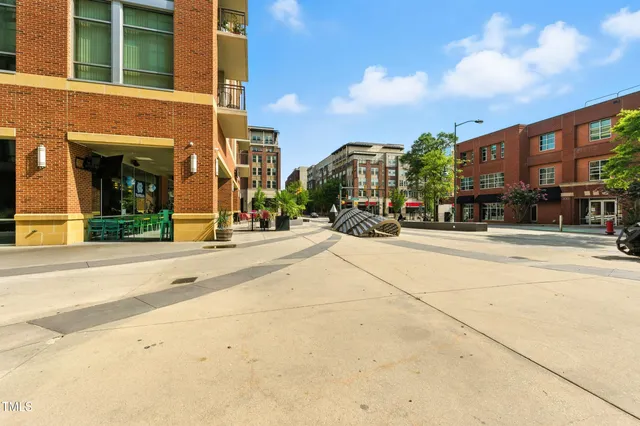 a view of a patio with couches and potted plants