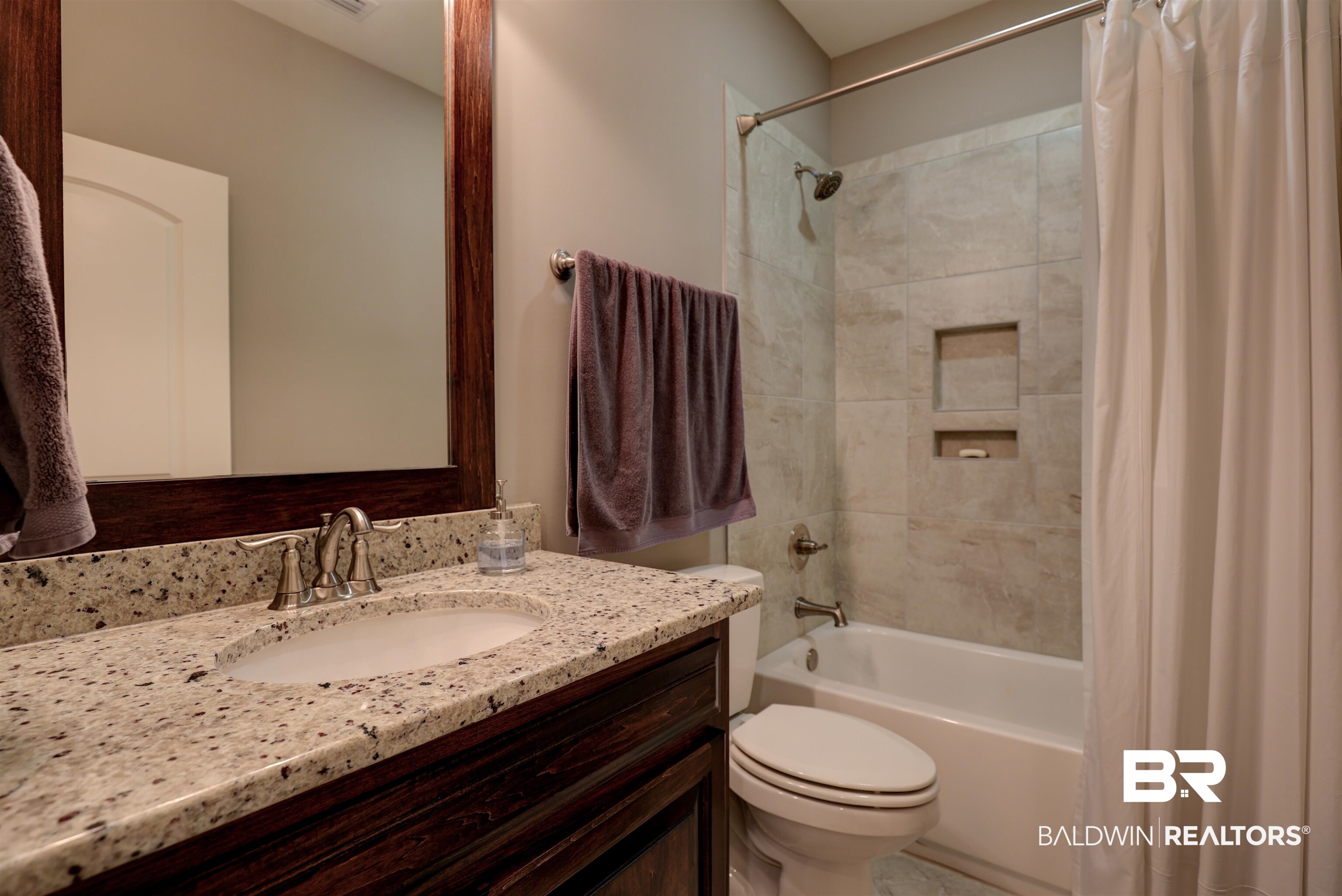 10588 Leesburg Pike Daphne, AL 36526 - Photo 20 of 29 Full bathroom featuring shower / bath combo, toilet, and vanity