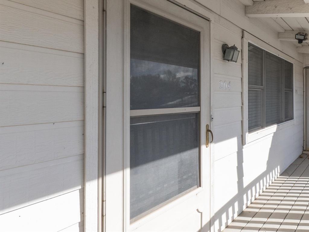 102 Harbor Drive, Unit 204 Runaway Bay, TX 76426 - Photo 2 of 17 a view of a balcony
