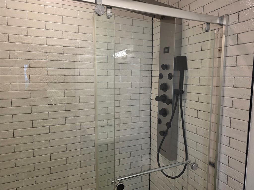 430 80th Way St. Pete Beach, FL 33706 - Photo 17 of 42 a bathroom with a shower