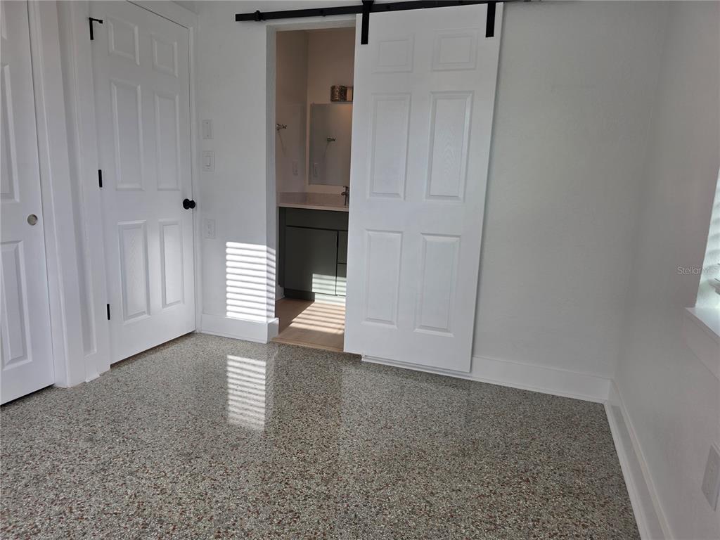 430 80th Way St. Pete Beach, FL 33706 - Photo 23 of 42 a view of empty room with window and entryway