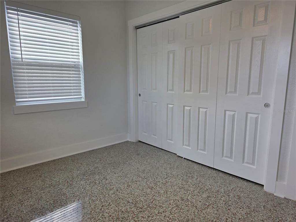 430 80th Way St. Pete Beach, FL 33706 - Photo 26 of 42 a view of an empty room with a window