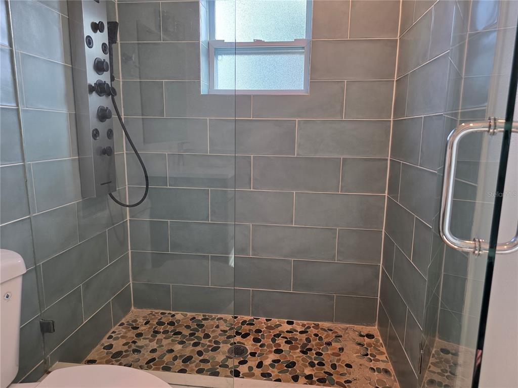 430 80th Way St. Pete Beach, FL 33706 - Photo 30 of 42 a bathroom with a shower