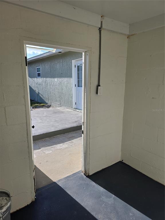 430 80th Way St. Pete Beach, FL 33706 - Photo 35 of 42 a bedroom with a bed and a mirror