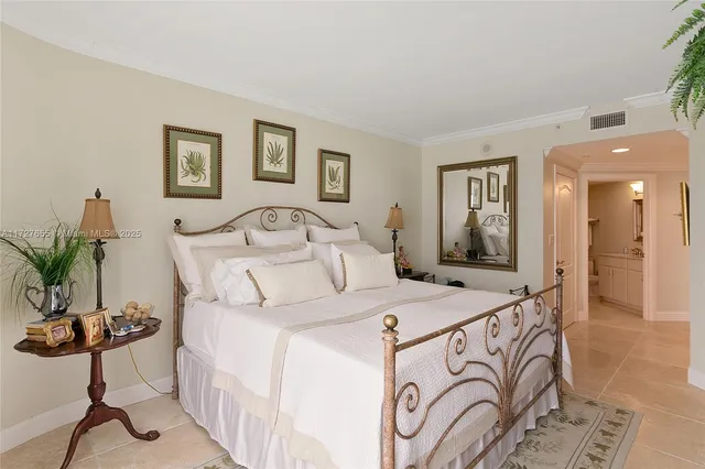 a bed room with a bed and a chair