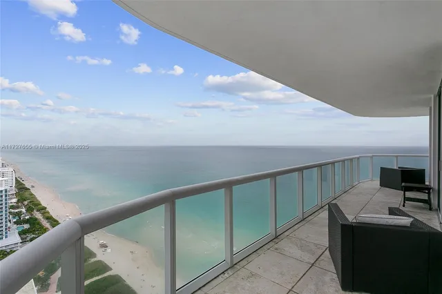 a view of balcony with furniture