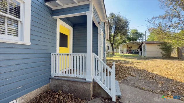 a view of a house with a porch