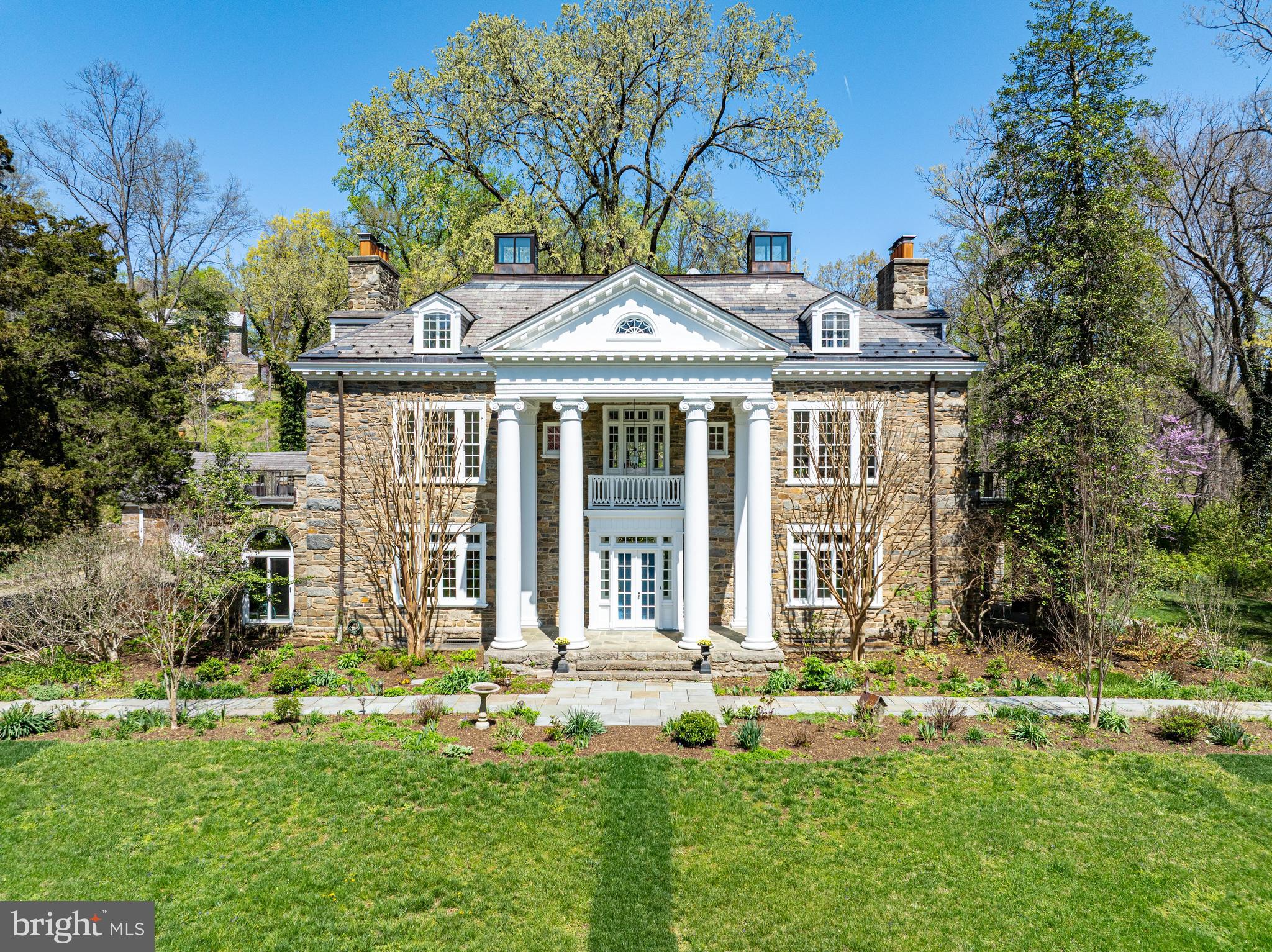 2325 Porter Street Northwest Washington, DC 20008 - Photo 1 of 50 a front view of a house with a yard