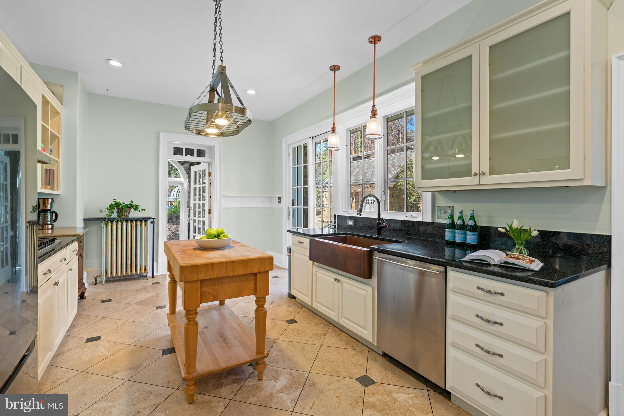 2325 Porter Street Northwest Washington, DC 20008 - Photo 12 of 50 a kitchen with stainless steel appliances granite countertop a stove a sink and a refrigerator