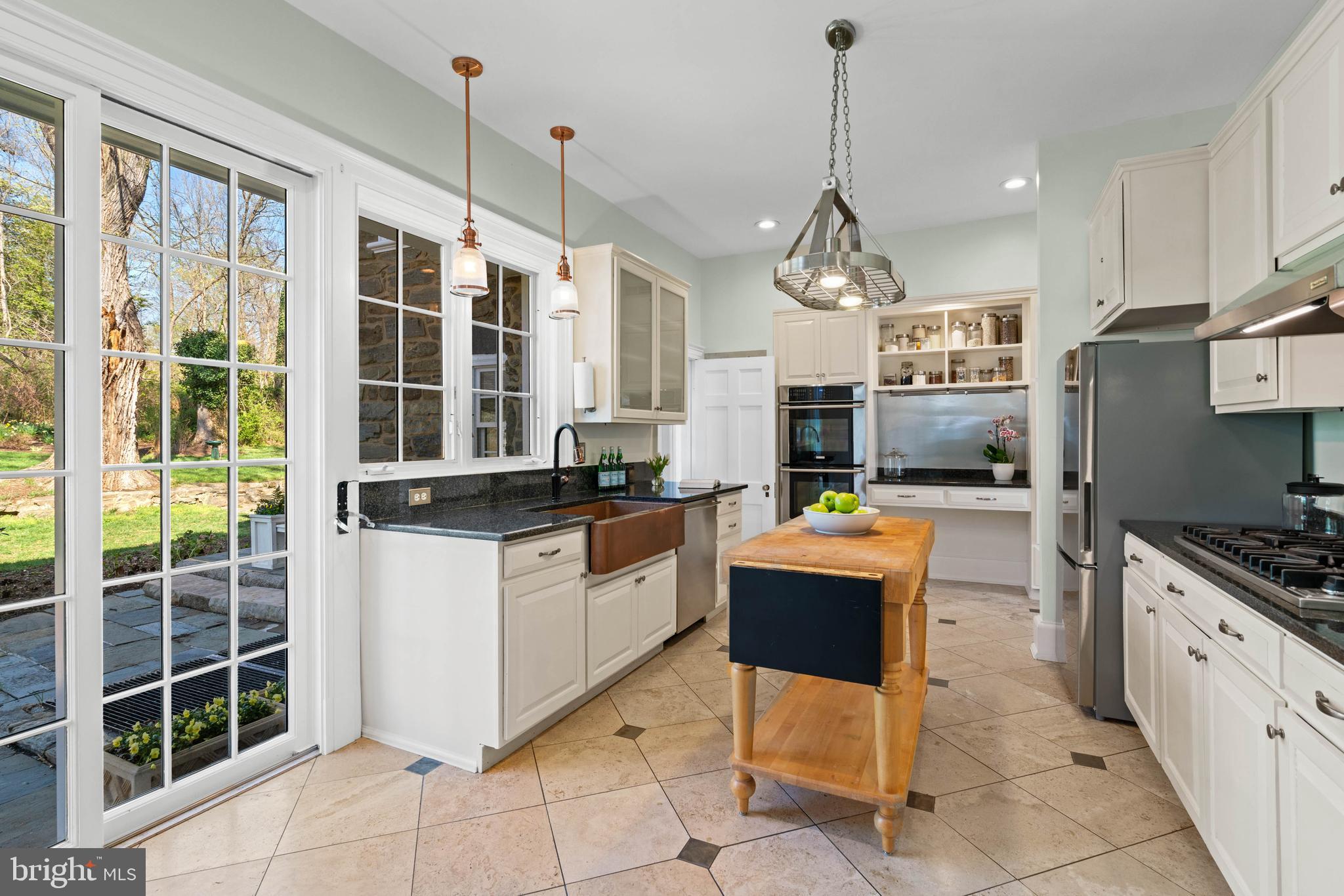 2325 Porter Street Northwest Washington, DC 20008 - Photo 13 of 50 a kitchen with granite countertop a sink stove and refrigerator