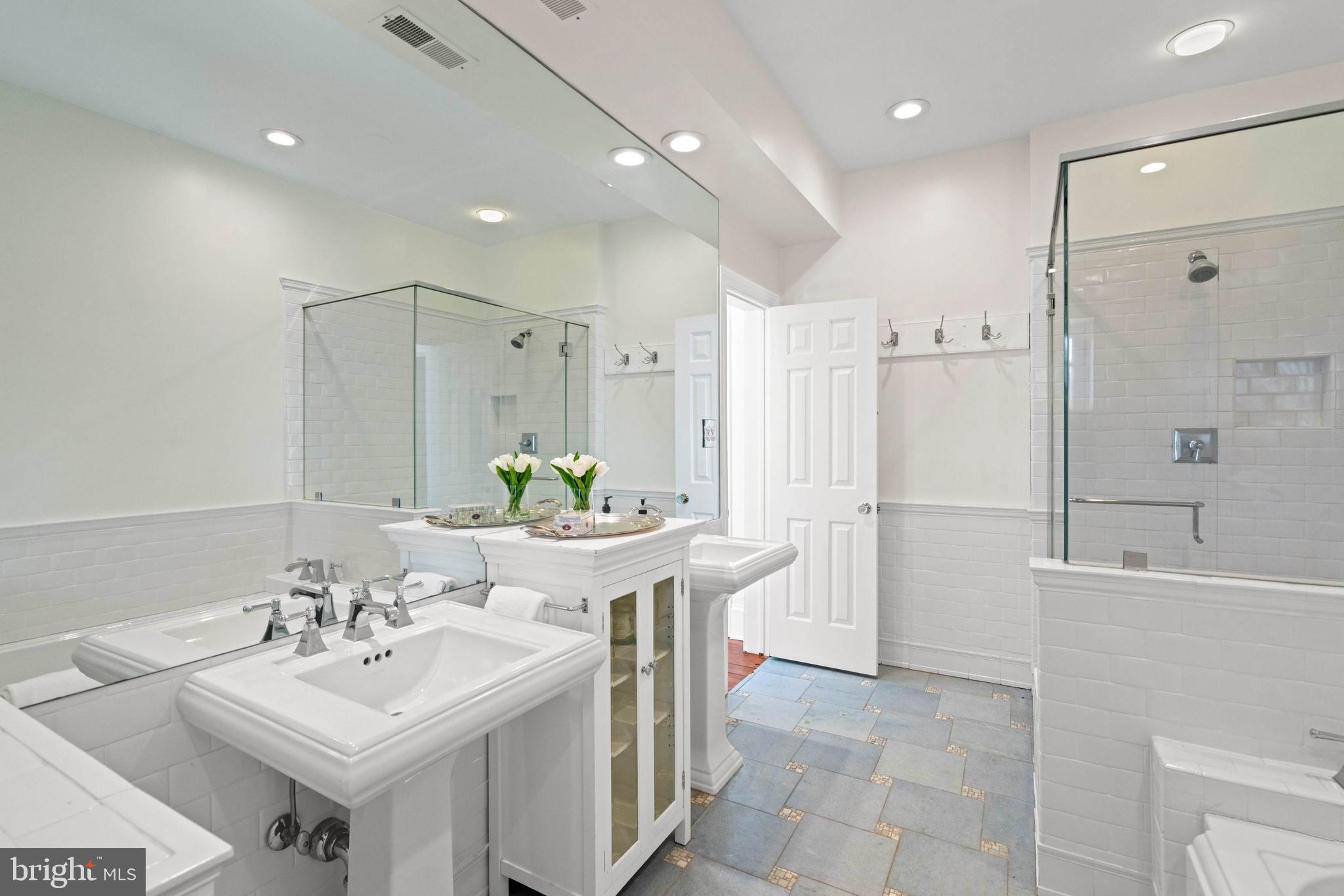 2325 Porter Street Northwest Washington, DC 20008 - Photo 23 of 50 a bathroom with a sink a toilet and shower