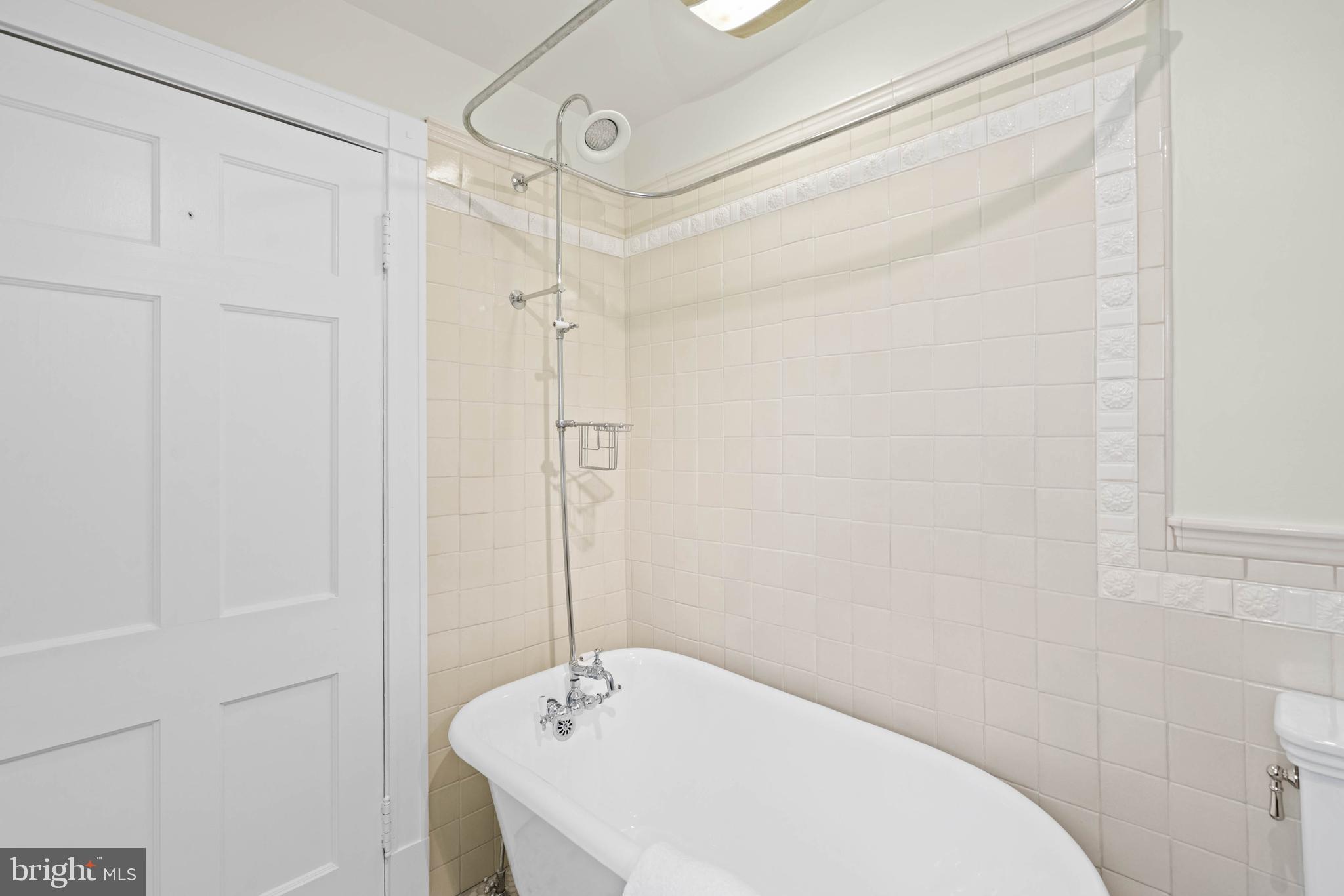 2325 Porter Street Northwest Washington, DC 20008 - Photo 30 of 50 a bathroom with a bathtub and shower
