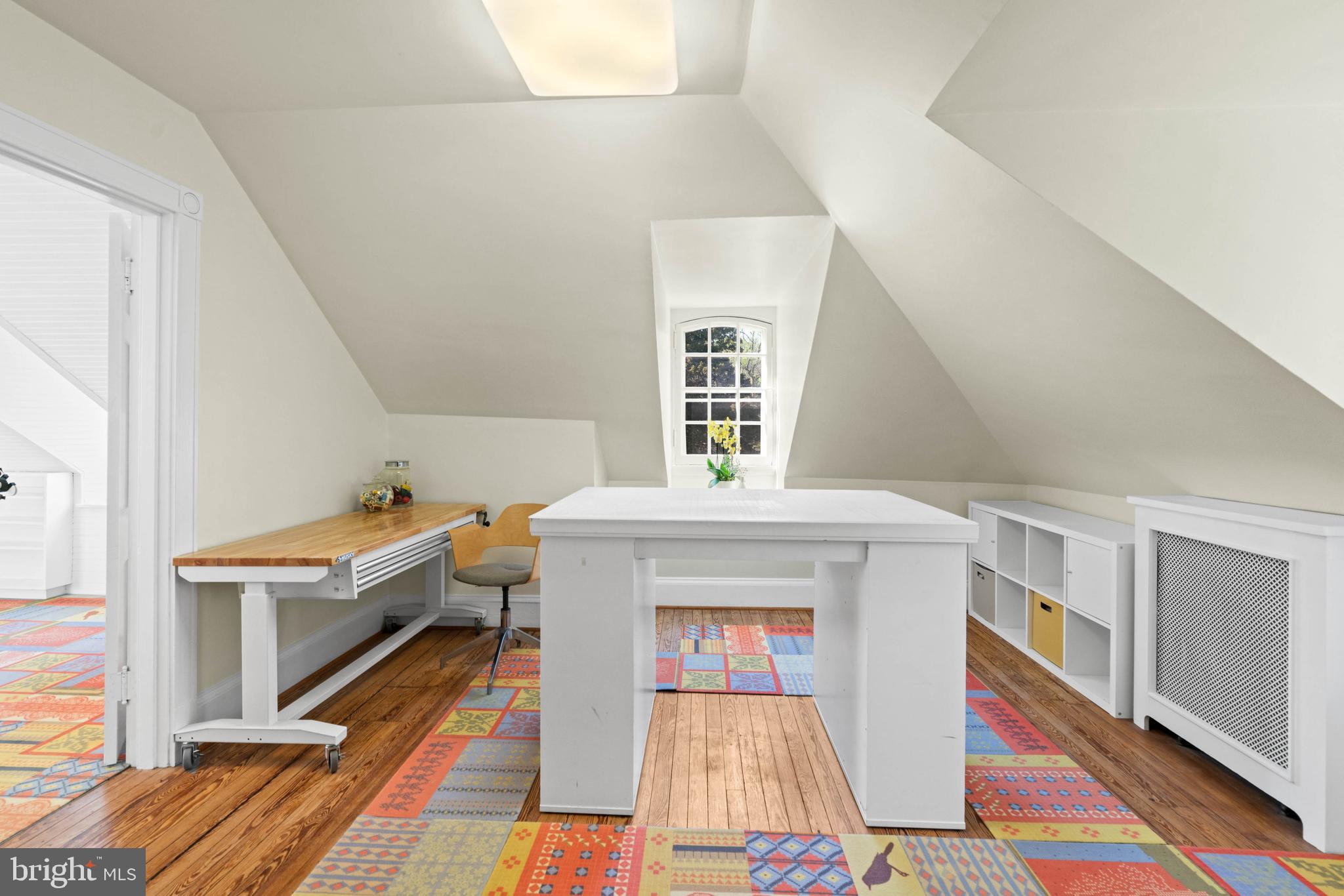 2325 Porter Street Northwest Washington, DC 20008 - Photo 36 of 50 a living room with a rug and a table with wooden floor