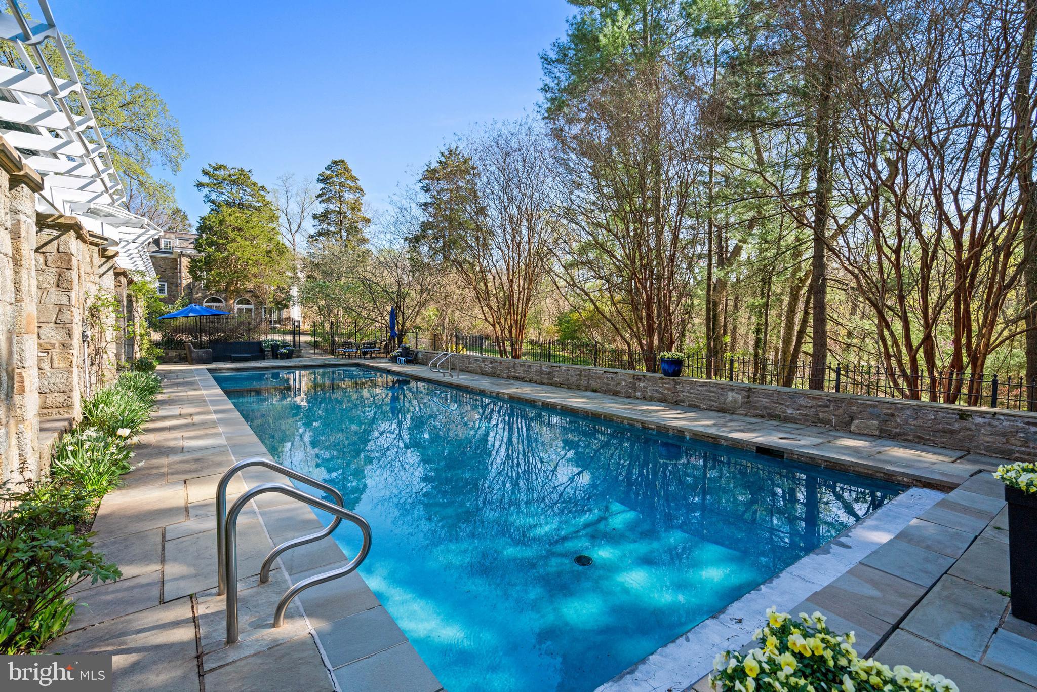 2325 Porter Street Northwest Washington, DC 20008 - Photo 37 of 50 a view of swimming pool with outdoor seating and plants