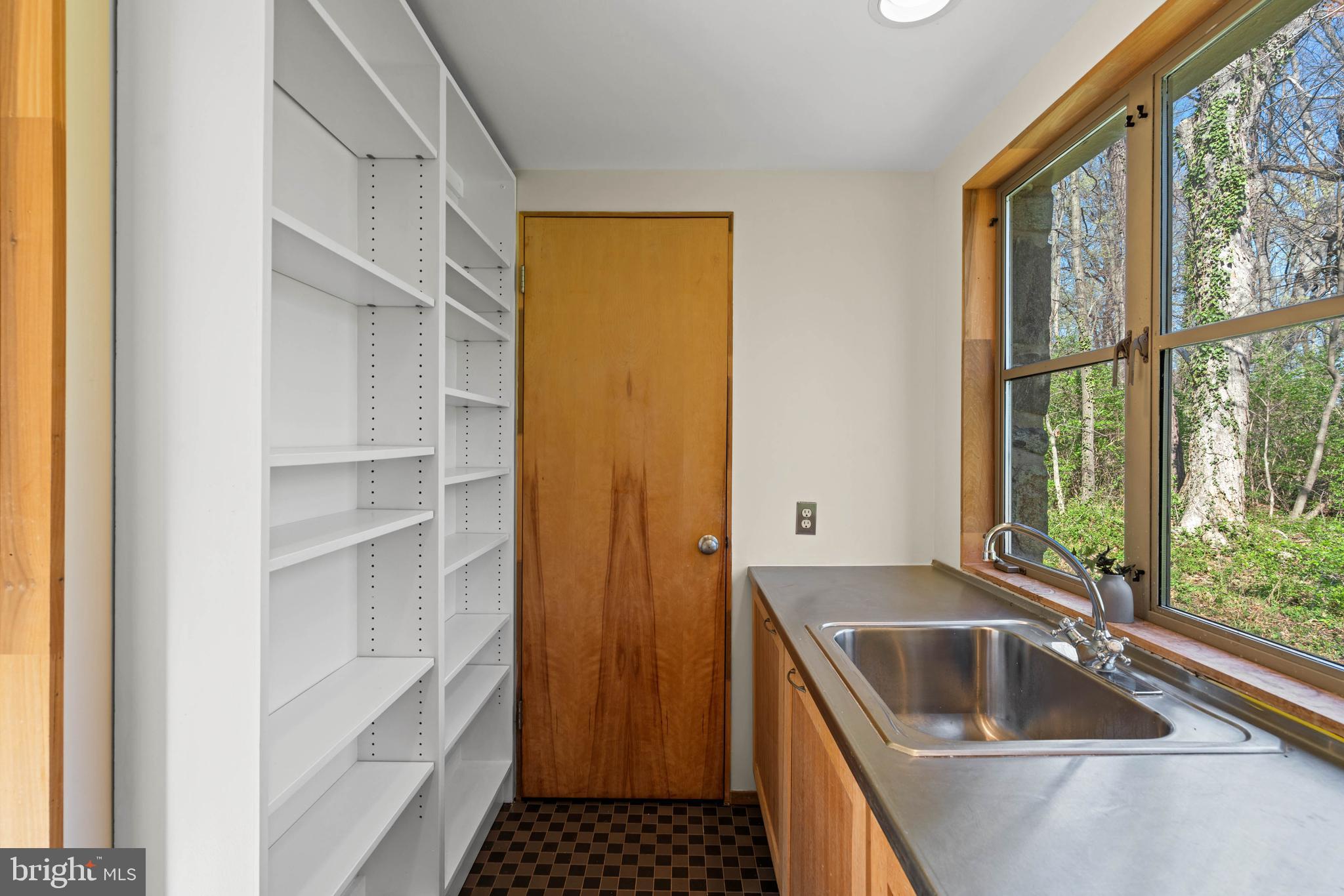 2325 Porter Street Northwest Washington, DC 20008 - Photo 44 of 50 a kitchen with a sink and a refrigerator