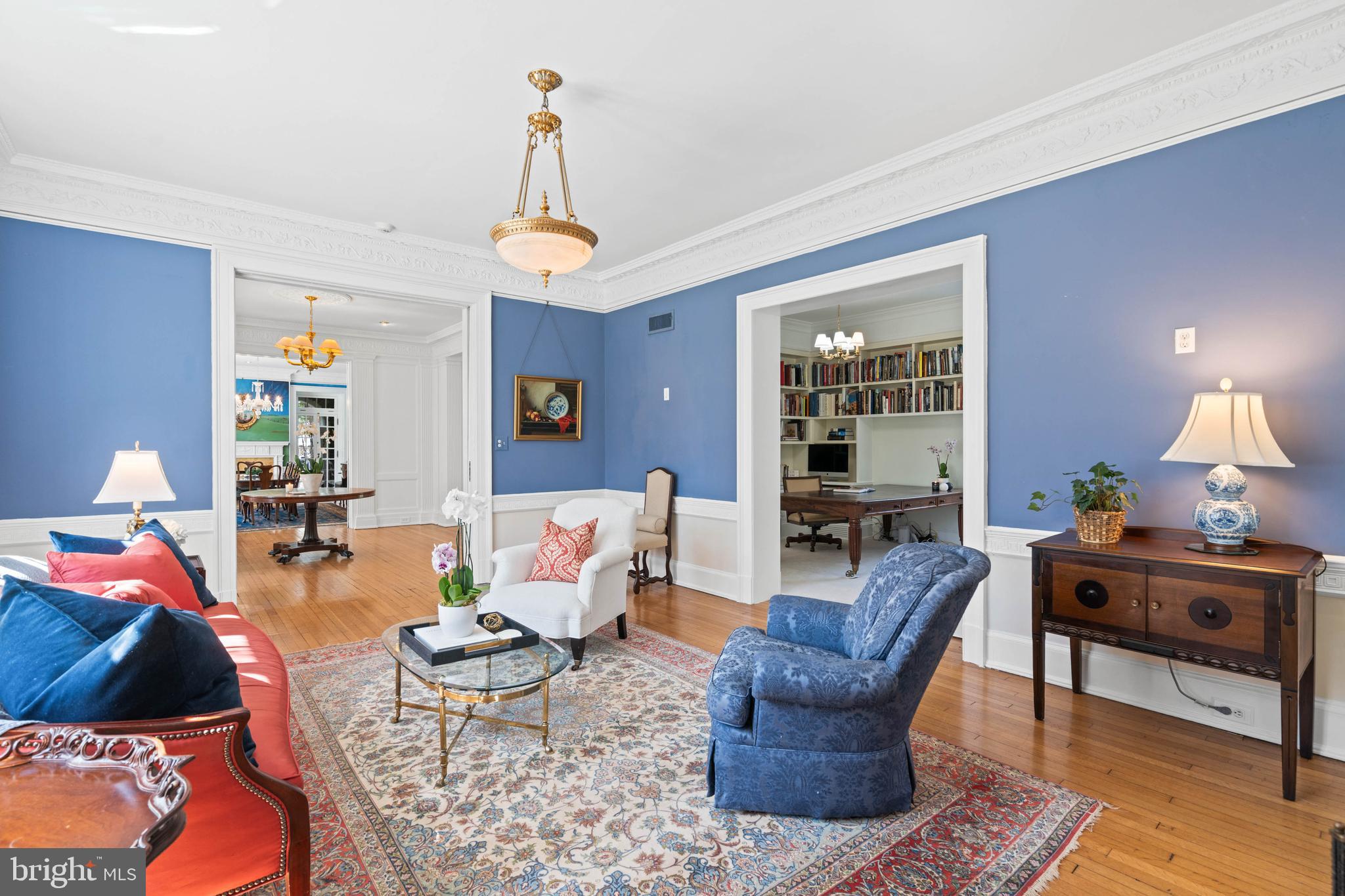 2325 Porter Street Northwest Washington, DC 20008 - Photo 7 of 50 a living room with furniture a lamp and a chandelier