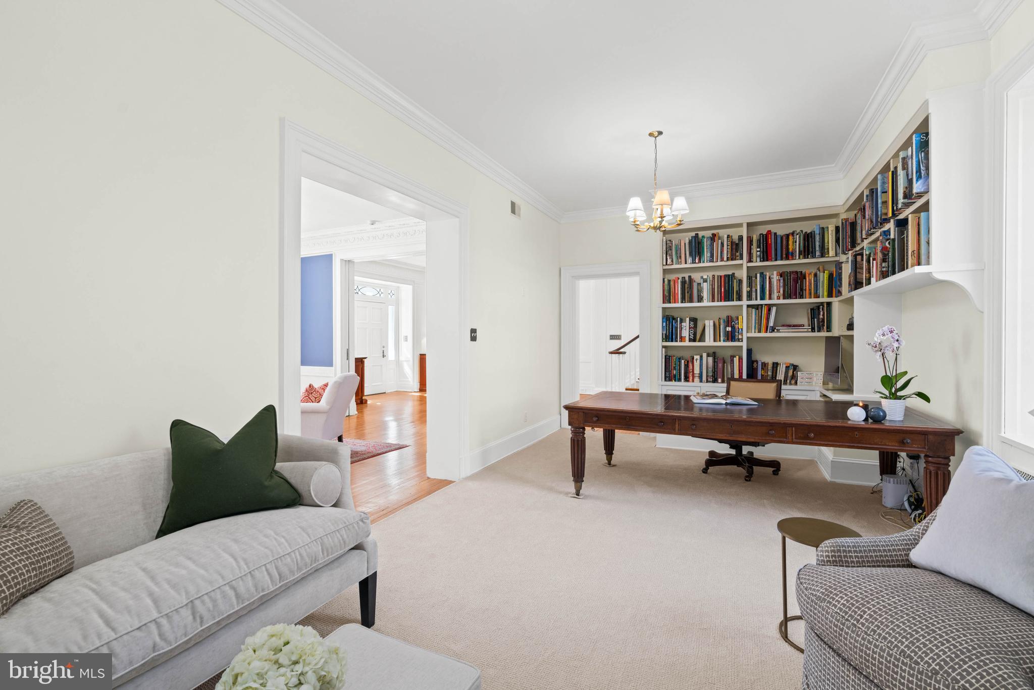 2325 Porter Street Northwest Washington, DC 20008 - Photo 9 of 50 a living room with furniture and a chandelier