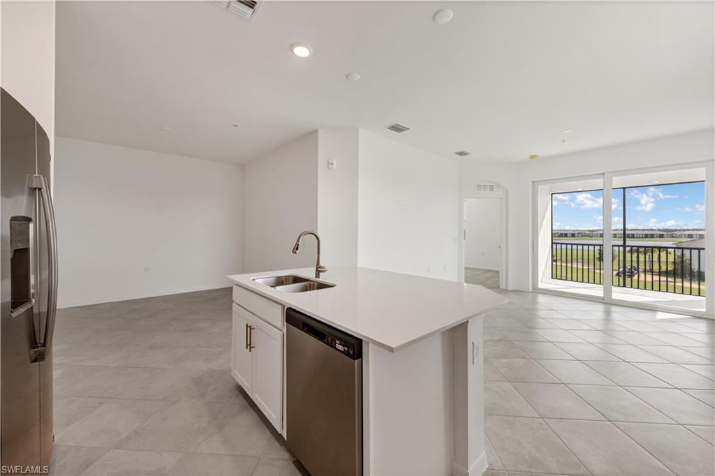43997 Boardwalk Loop, Unit 1838 Punta Gorda, FL 33982 - Photo 15 of 45 a view of a kitchen with a sink and a window
