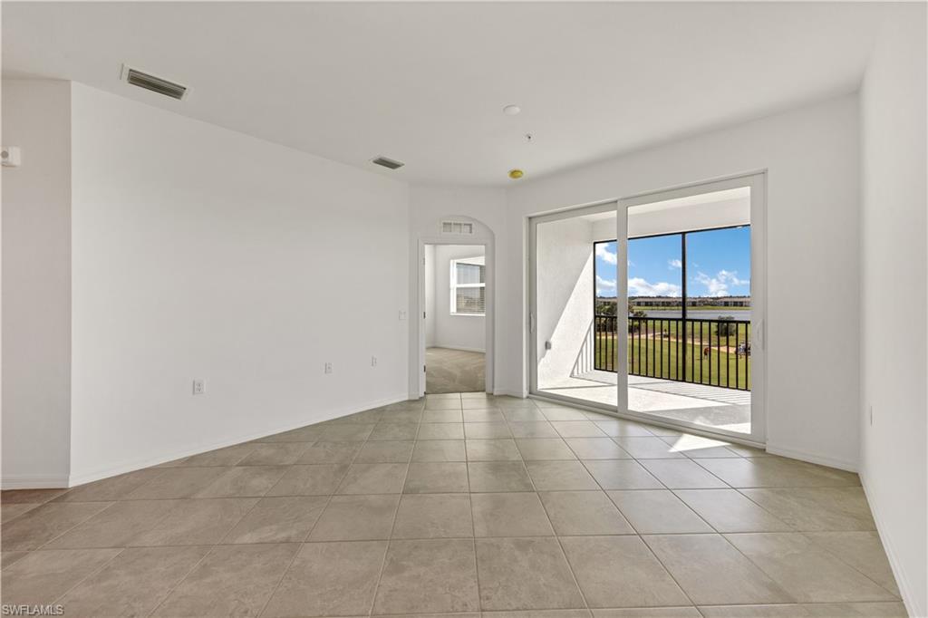 43997 Boardwalk Loop, Unit 1838 Punta Gorda, FL 33982 - Photo 17 of 45 a view of an empty room with a kitchen