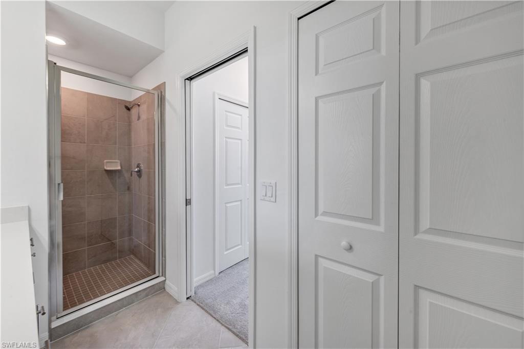 43997 Boardwalk Loop, Unit 1838 Punta Gorda, FL 33982 - Photo 30 of 45 a bathroom with a glass shower door