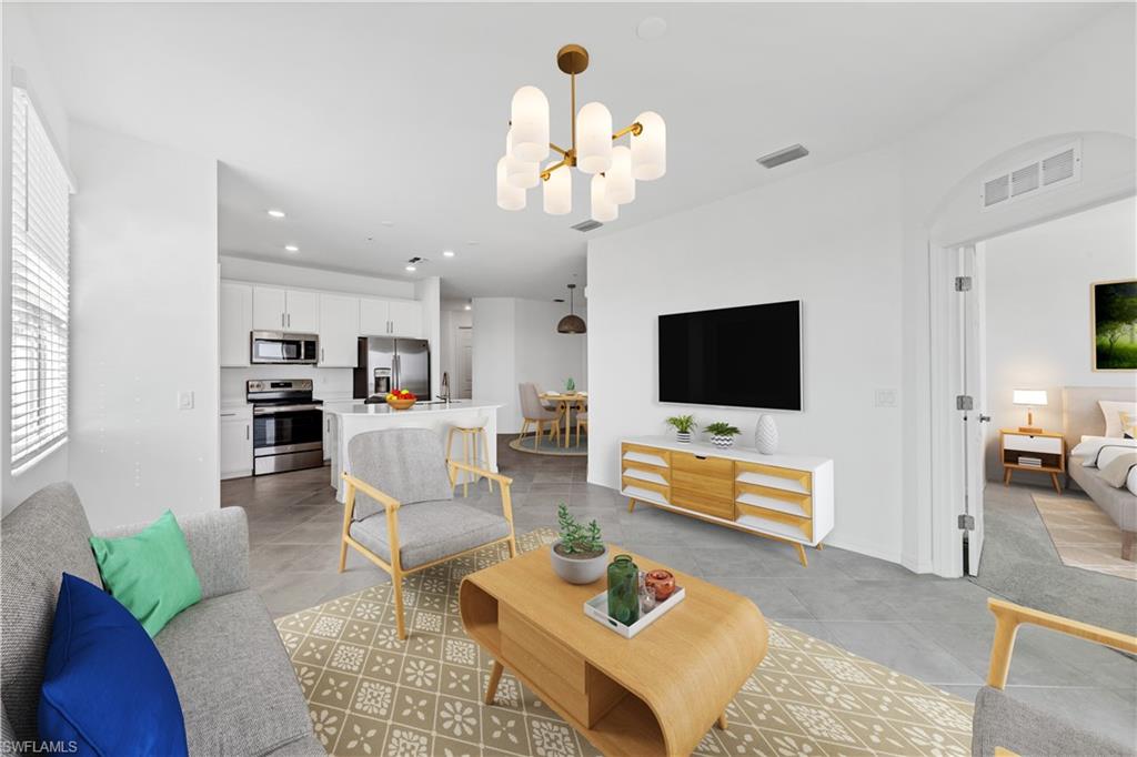 43997 Boardwalk Loop, Unit 1838 Punta Gorda, FL 33982 - Photo 3 of 45 a living room with furniture and a flat screen tv