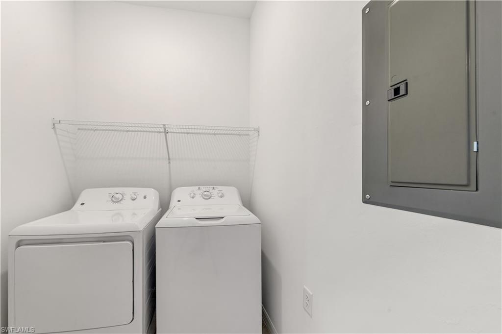 43997 Boardwalk Loop, Unit 1838 Punta Gorda, FL 33982 - Photo 40 of 45 a utility room with dryer and washer