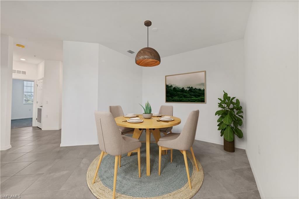 43997 Boardwalk Loop, Unit 1838 Punta Gorda, FL 33982 - Photo 4 of 45 a view of a dining room with furniture and wooden floor