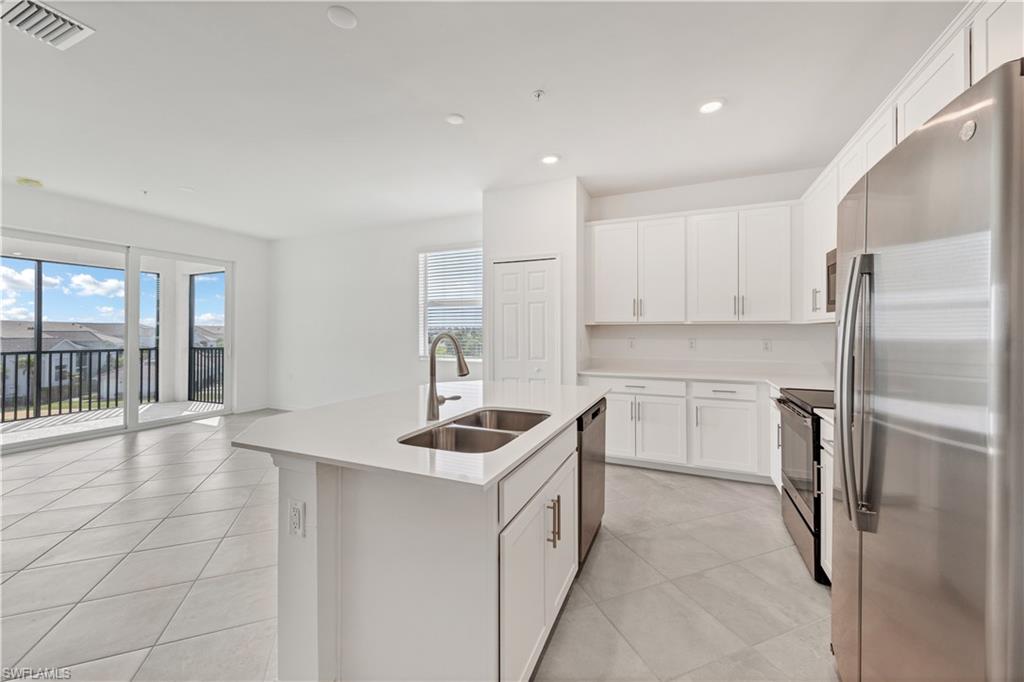 43997 Boardwalk Loop, Unit 1838 Punta Gorda, FL 33982 - Photo 10 of 45 a kitchen that has a sink cabinets counter space and appliances