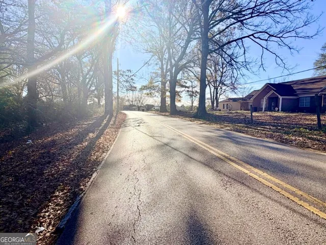 a view of a house with a snow on the road