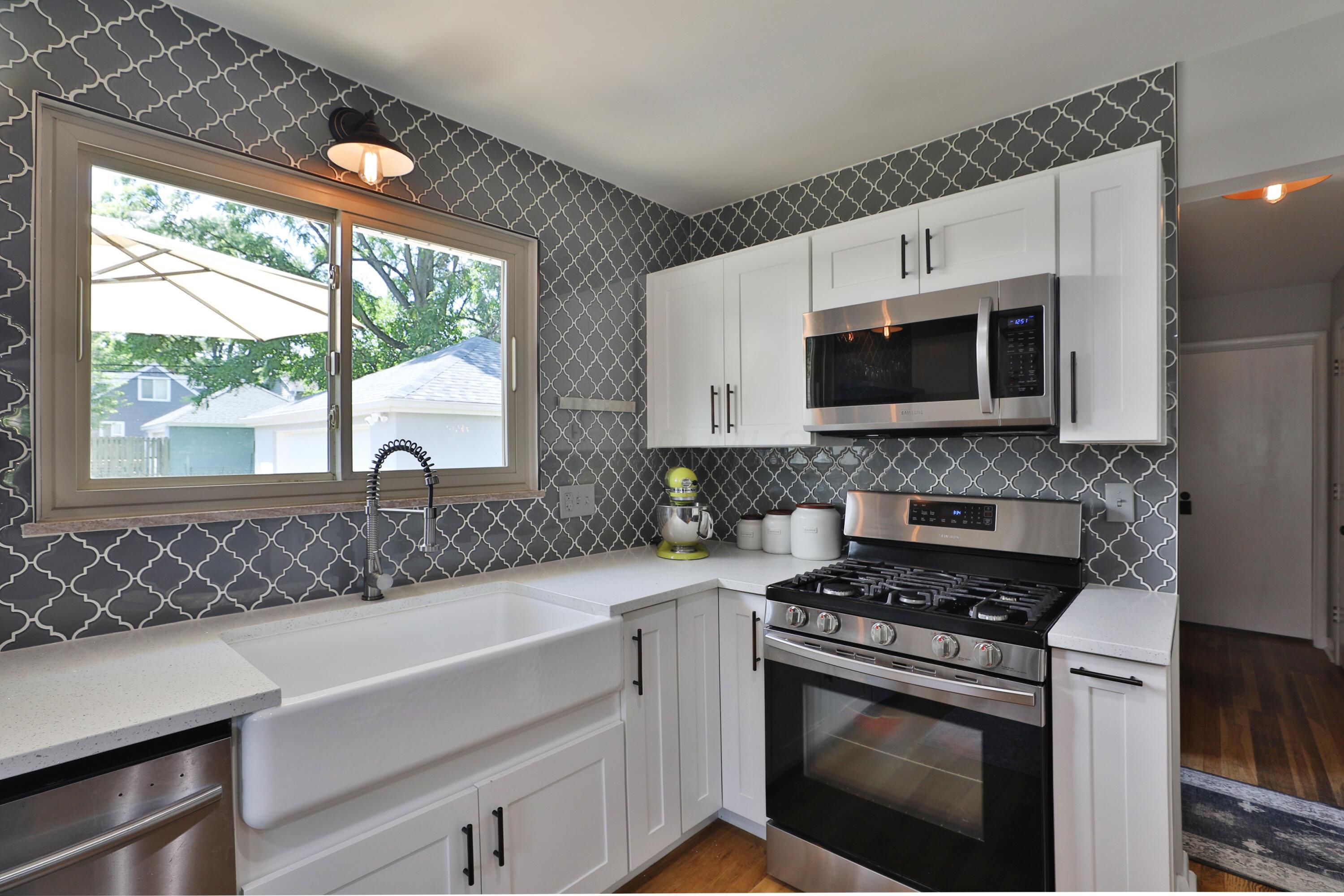 315 South Kellner Road Columbus, OH 43209 - Photo 17 of 51 Farmhouse sink, patterned tie backsplash