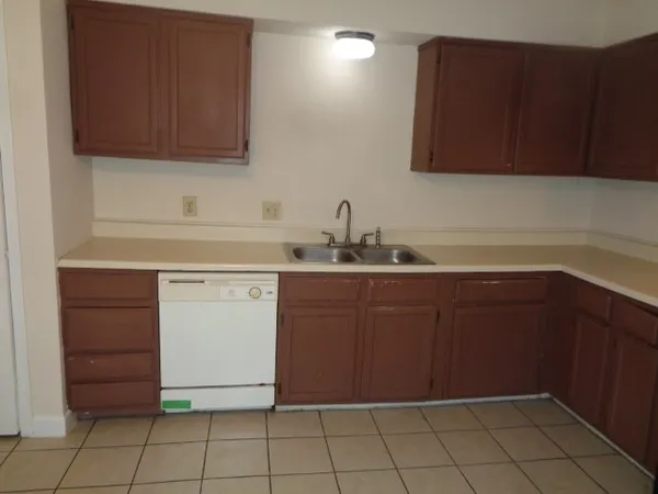 a kitchen with a sink and cabinets