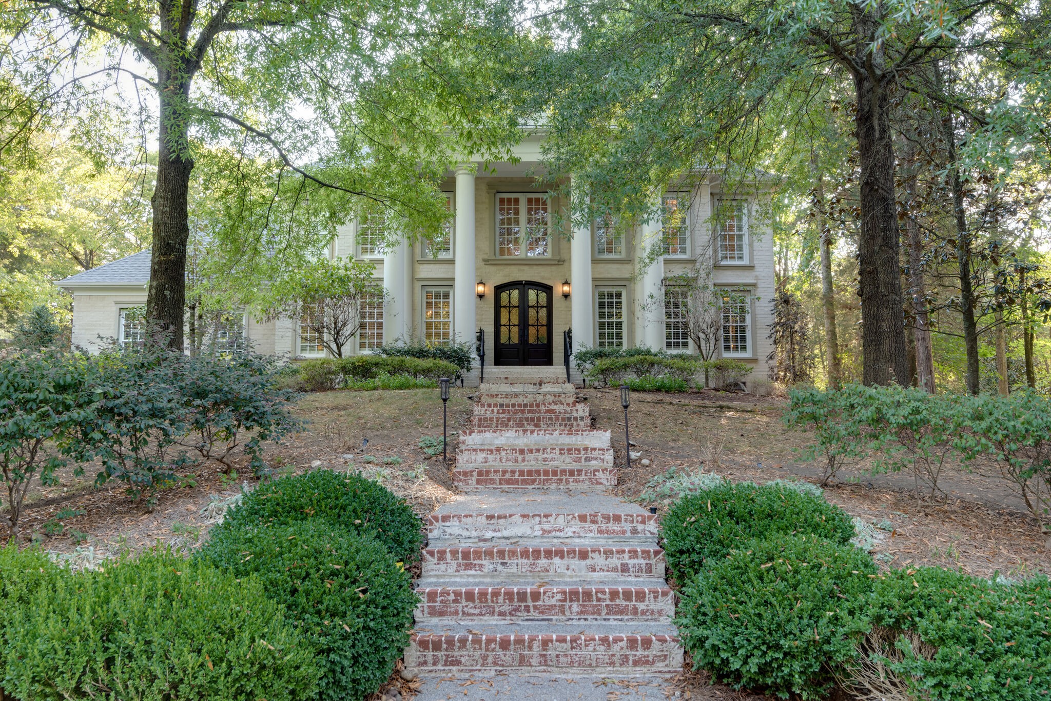 a front view of a house with garden