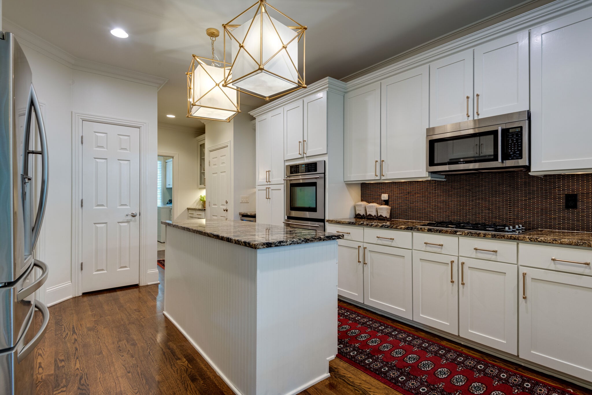 1432 Willowbrooke Circle Franklin, TN 37069 - Photo 11 of 41 a kitchen with stainless steel appliances a microwave a stove and white cabinets