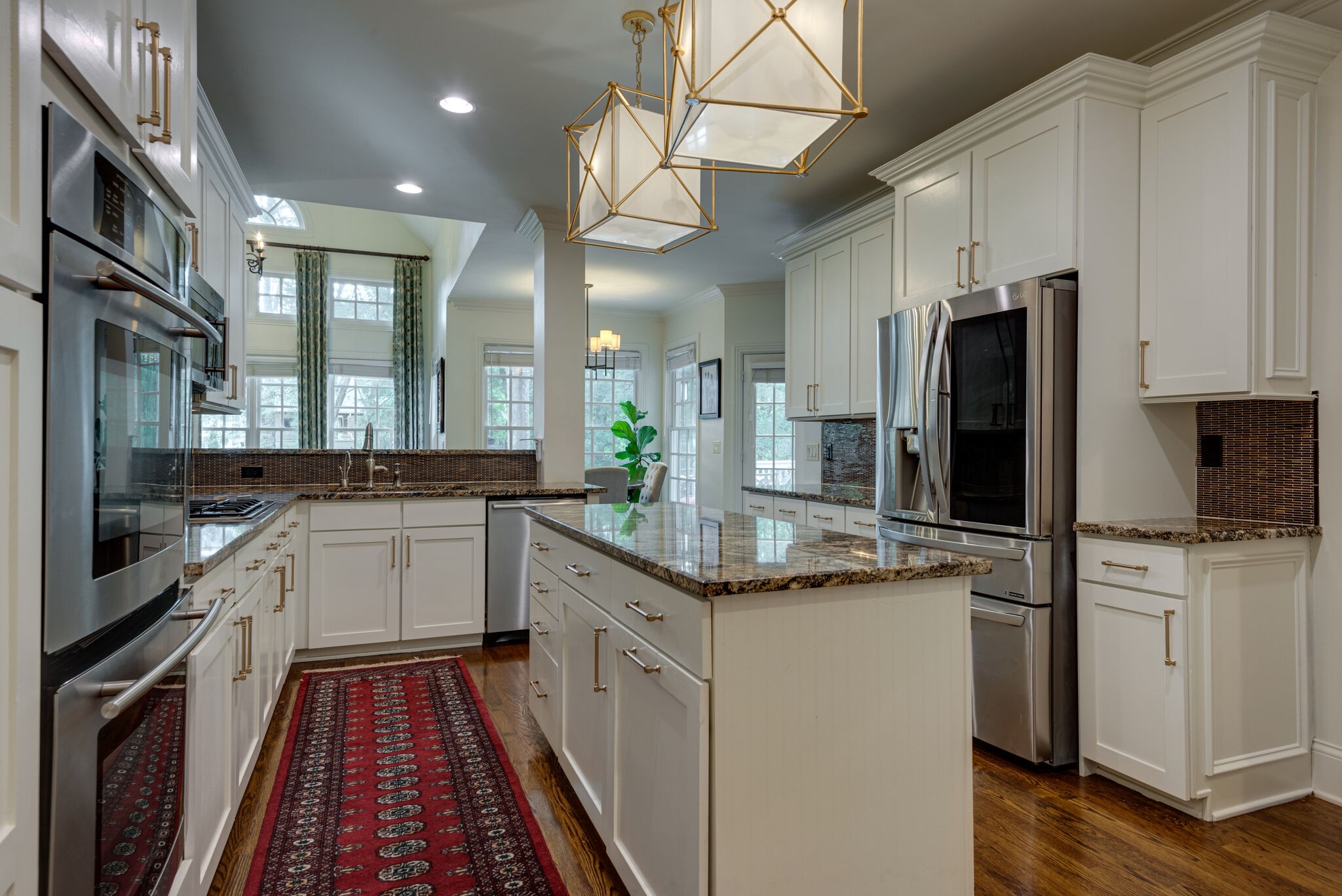 1432 Willowbrooke Circle Franklin, TN 37069 - Photo 9 of 41 a kitchen with stainless steel appliances granite countertop a refrigerator and a stove top oven