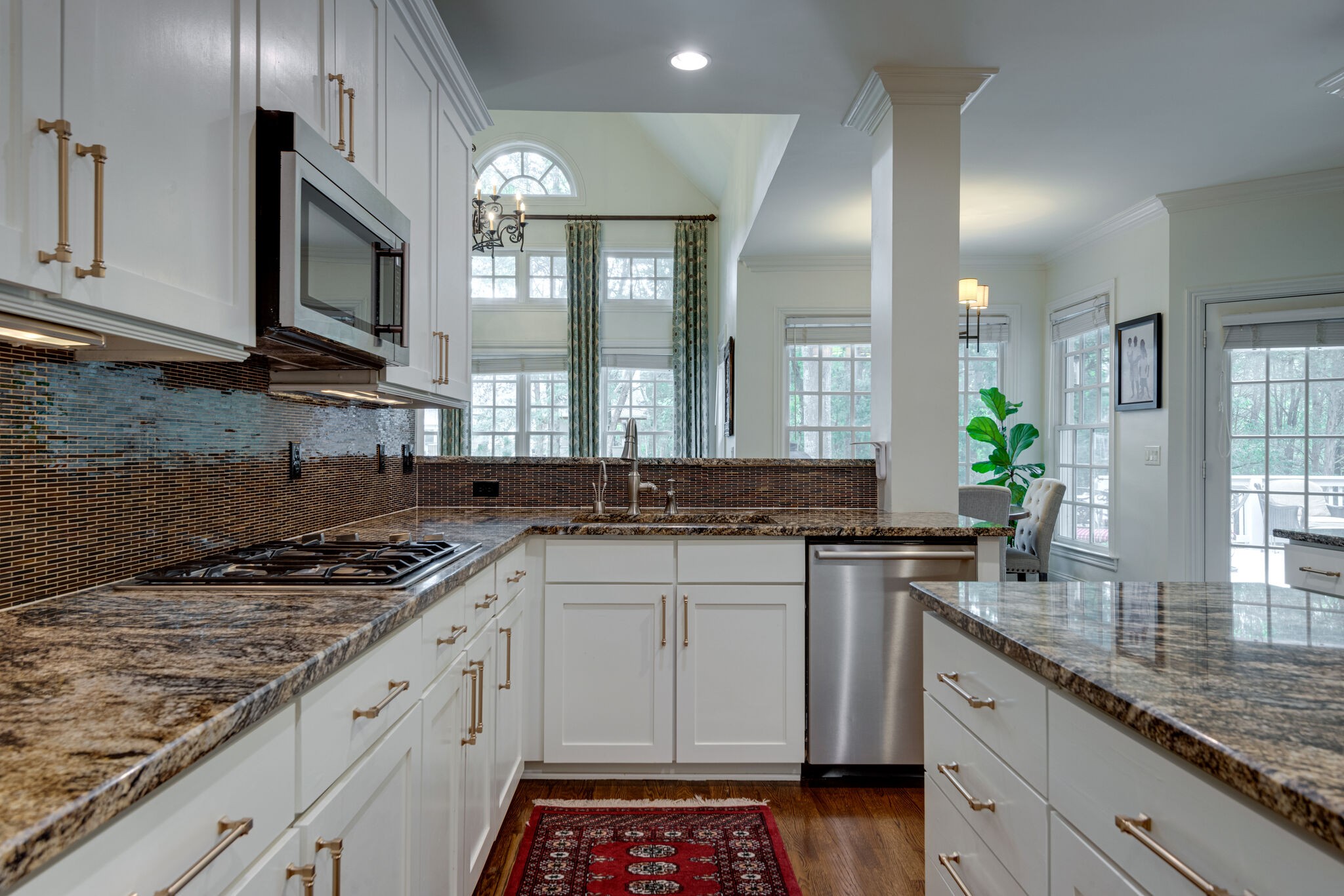 1432 Willowbrooke Circle Franklin, TN 37069 - Photo 10 of 41 a kitchen with stainless steel appliances granite countertop a sink stove and cabinets