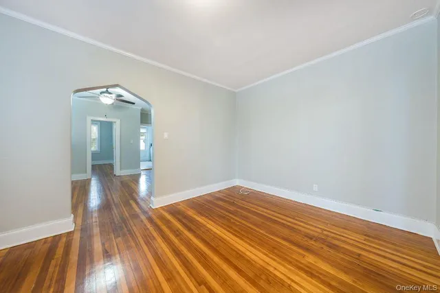 a view of a room with wooden floor