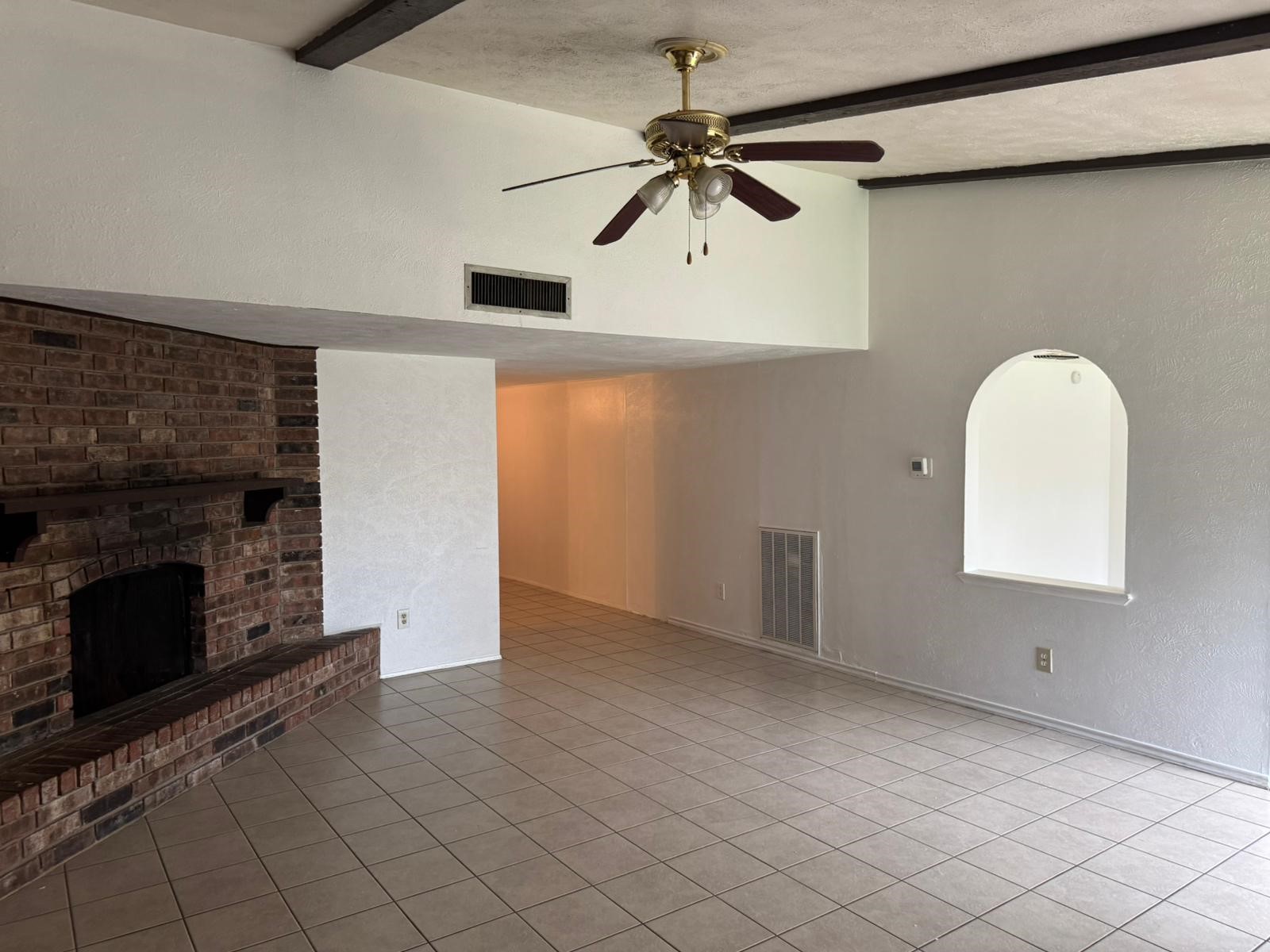 6110 West Ridgecreek Drive Houston, TX 77053 - Photo 4 of 13 an empty room with windows and fireplace