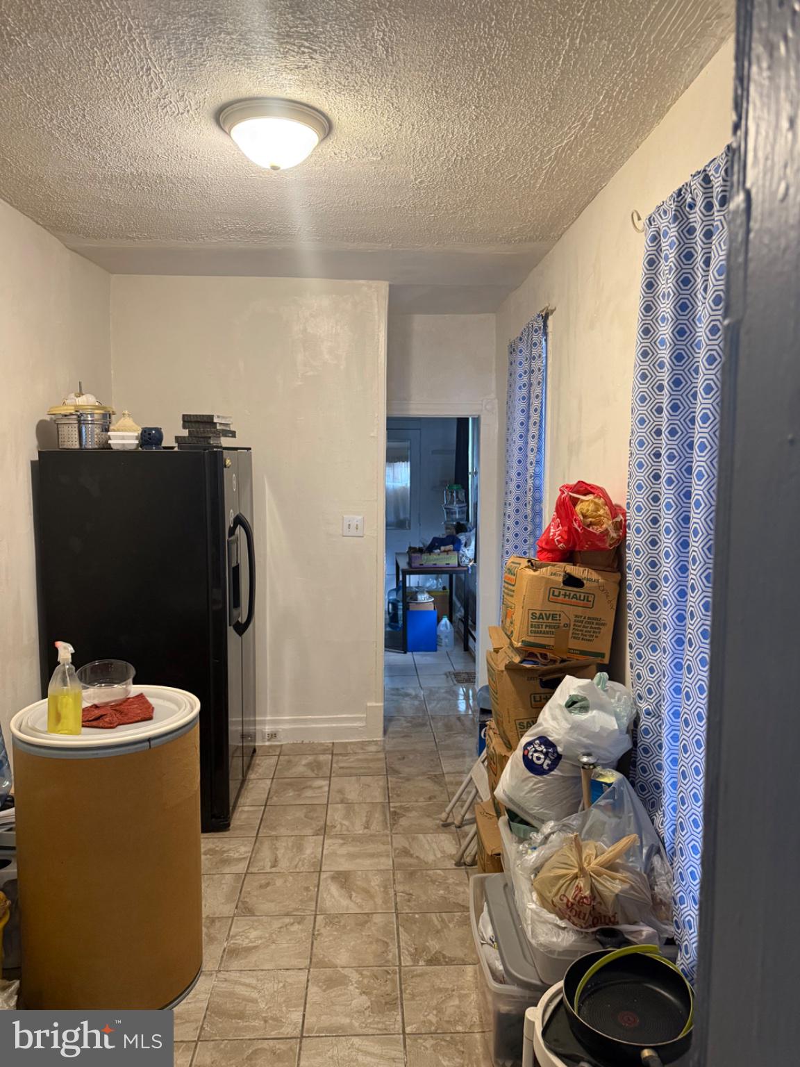 115 West Elm Street Reading, PA 19601 - Photo 11 of 13 Cluttered kitchen with potential charm.