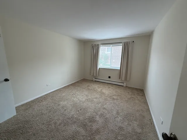 an empty room with a empty space and window