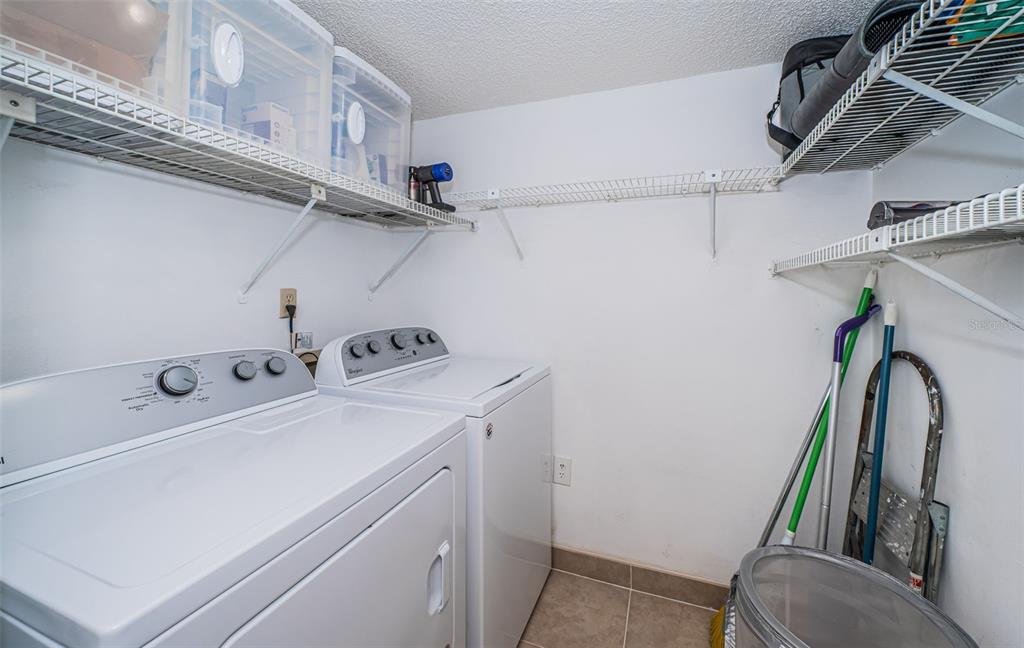 2522 Pine Ridge Way South, Unit A2 Palm Harbor, FL 34684 - Photo 18 of 34 a utility room with dryer and washer