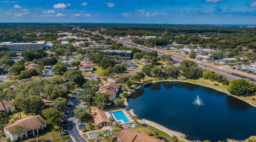 2522 Pine Ridge Way South, Unit A2 Palm Harbor, FL 34684 - Photo 21 of 34 an aerial view of residential houses with outdoor space