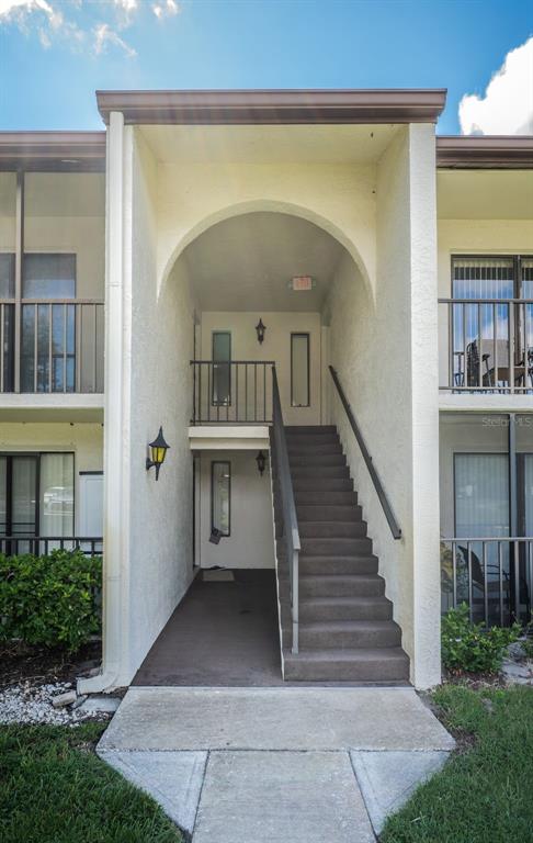 2522 Pine Ridge Way South, Unit A2 Palm Harbor, FL 34684 - Photo 3 of 34 a view of entryway and hall with wooden floor