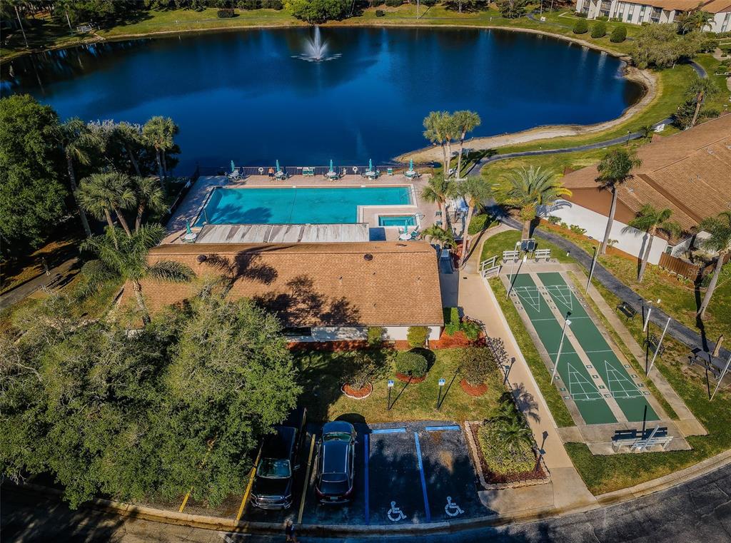 2522 Pine Ridge Way South, Unit A2 Palm Harbor, FL 34684 - Photo 32 of 34 an aerial view of a house with a yard