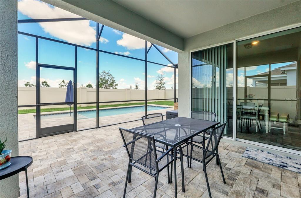 2001 Spring Shower Circle Kissimmee, FL 34744 - Photo 23 of 25 a view of a porch with chairs and backyard