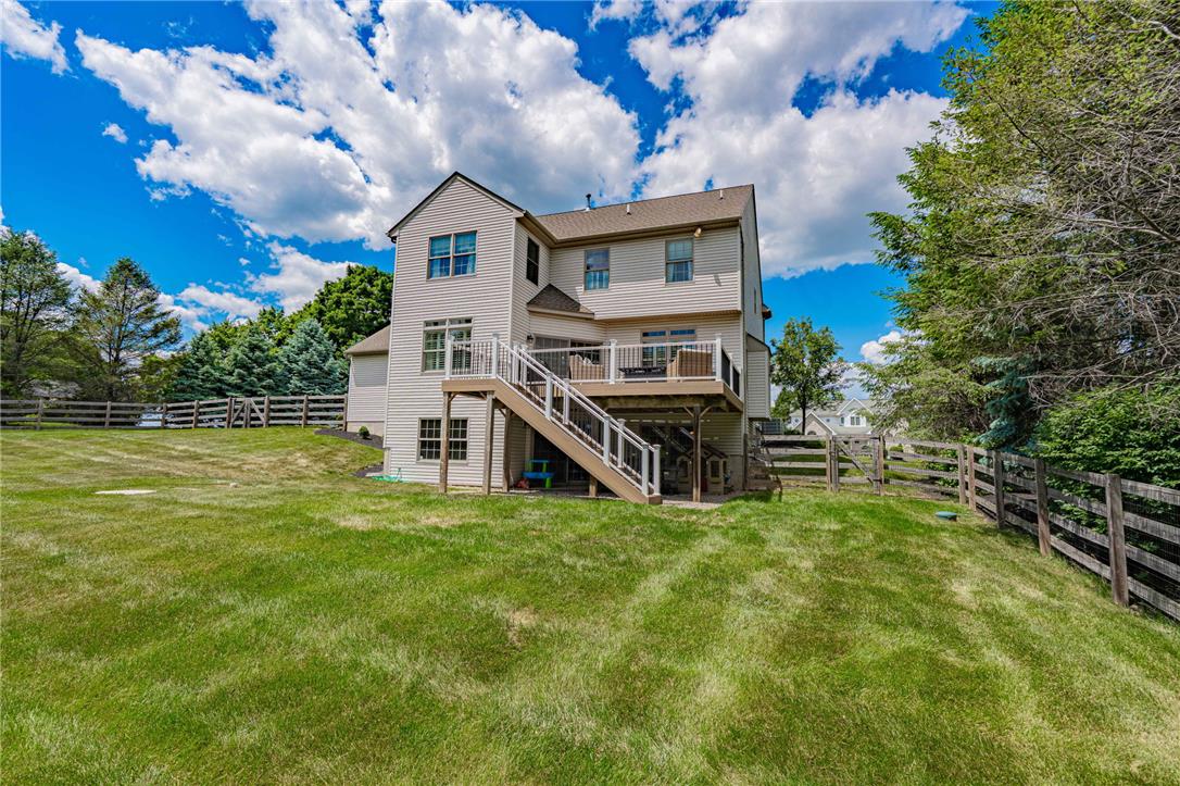 6000 Pond View Terrace Bath, PA 18014 - Photo 56 of 69 An inviting tiered deck overlooks a sprawling green yard, perfect for outdoor living.