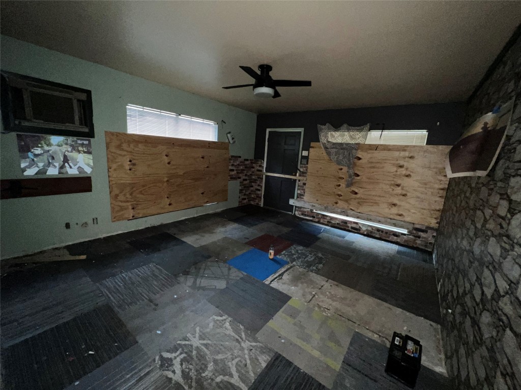 5722 Manor Road Austin, TX 78723 - Photo 15 of 16 a living room with furniture and a flat screen tv