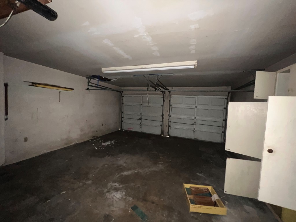5722 Manor Road Austin, TX 78723 - Photo 5 of 16 a view of storage and utility room with a refrigerator
