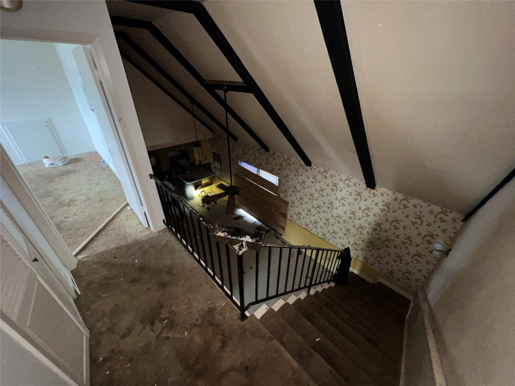 5722 Manor Road Austin, TX 78723 - Photo 7 of 16 a view of staircase with railing and white walls