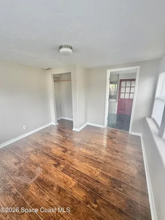 a view of an empty room with a window