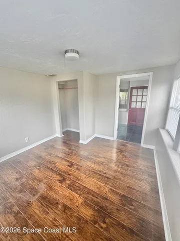 a view of an empty room with a window